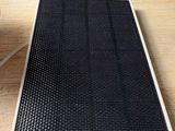 an image of a solar panel on a table next to a cup of coffee