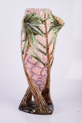 pink and green glass vase with a tree design on it
