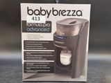the box of the babybrezza machine is open on the table