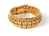 gold plated bracelet on a white background with a white background