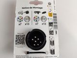 a black button on a white background with a barcode