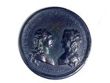 an image of a coin with two people on it