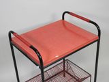an image of a cart with a red tray on it