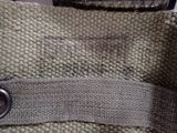 a close up of a bag with a button on it
