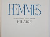 a white book with blue writing on the cover of a book