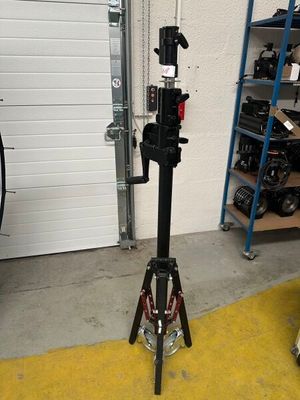 a camera on a tripod in a garage