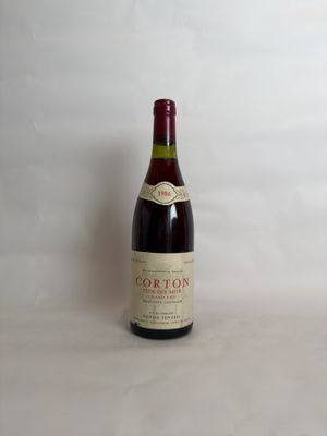 a bottle of wine that is sitting on a table
