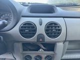 a car dashboard with a clock and a radio in it