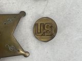 a small badge and a small badge on a white surface