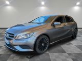 la mercedes cla est garée dans un garage dont le sol est recouvert de carreaux