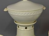 four bowls and a saucer sitting on a table