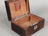 a small wooden box that is open on a table
