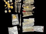 an image of a collection of gold and silver items on a black background