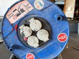 an image of a blue hose sitting on top of a metal stand