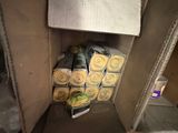 a cardboard box filled with rolls of food inside of it