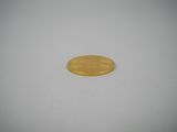 a close up of a gold coin on a white surface
