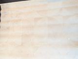a piece of paper that has been cut up on a table