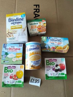 several boxes of food sitting on top of a cardboard box