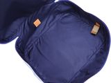 an open blue suitcase with a tag on it
