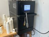 a coffee machine that is sitting on top of a shelf
