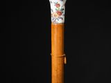 a close up of a wooden stick with a floral design on it