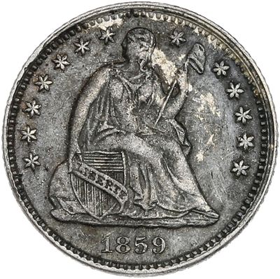 une pièce d'argent sur laquelle est représentée une femme assise