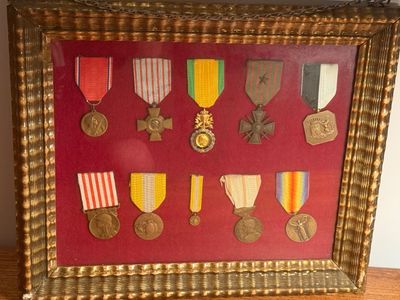 an image of a framed picture of medals and medals on display