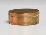 a small metal box with a lid on a white surface