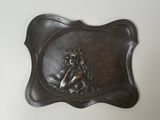 an image of a metal plaque with a mermaid on it
