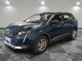 a blue car is parked in a room with a checkered floor
