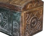 a wooden chest with carvings on it on a white background