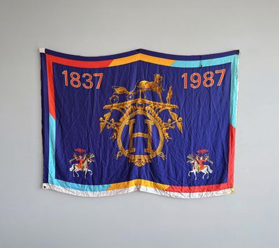 an image of a flag hanging on a wall in a room