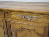a wooden cabinet with a drawer on top of it