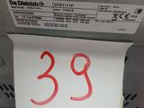 a close up of a piece of paper on the back of a machine