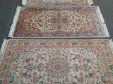 several rugs are laid out on the floor in a room