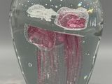 a glass vase that has a jelly inside of it
