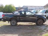 a picture of a black truck parked in a lot