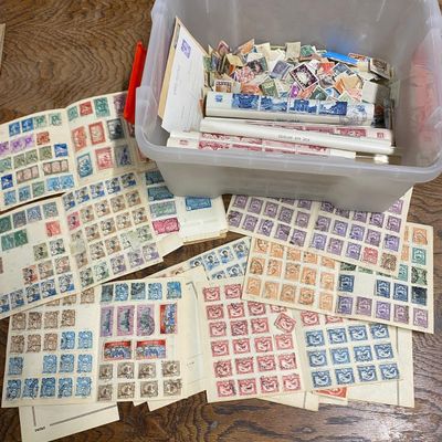 many different stamps in a container on the table