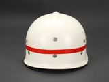 a close up of a white helmet with a red stripe on it
