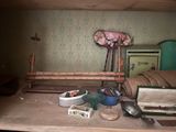 a picture of a room with a bed, a chair, a suitcase, and other items