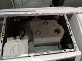 a white washer and a dryer sitting on top of each other