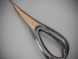 a large pair of scissors that are sitting on a table