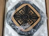 a cardboard box with a plastic cover and a black and white picture of a manhole