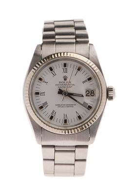 an image of a wrist watch with roman numerals on the dial