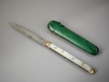 a knife and a knife sharper on a table