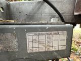 a machine that is sitting on the ground in the woods