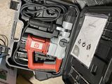 a tool in a case that is sitting on the floor