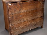 an old wooden chest of drawers with a drawer underneath it