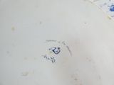 a white plate with a blue and white design on it