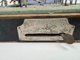 a statue of a man riding a horse on the back of a suitcase